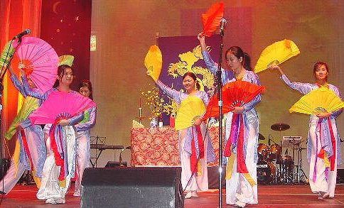 Stage decorations for Vietnamese New Year in Canada include candles, 