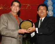 CEO Randy Martinez received a commemorative plate from Lam Van Ba, HCMC, Dep Chief Foreign Affairs